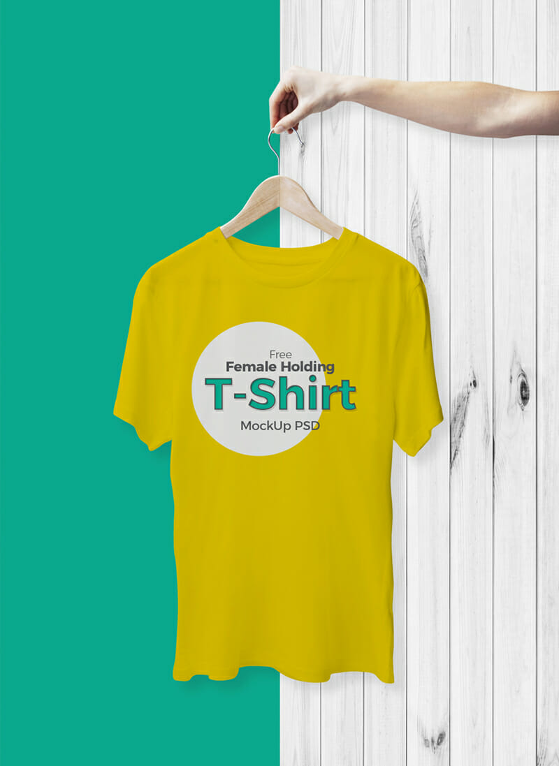 Female Holding With Hanger T-Shirt Mockup - Awesome Mockups